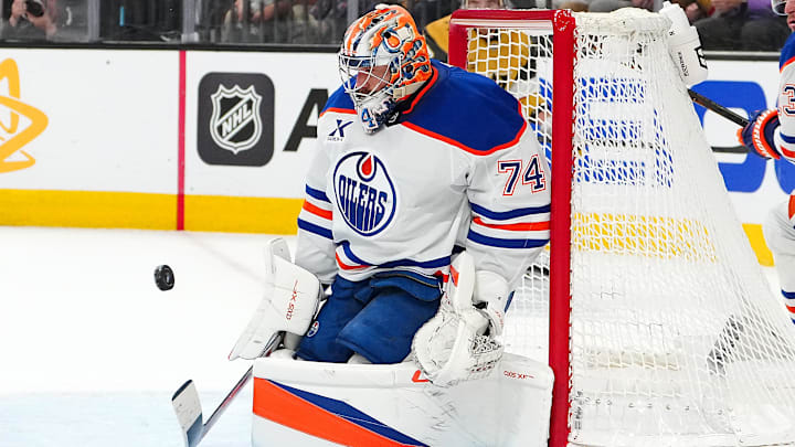 May 14, 2025; Las Vegas, Nevada, USA; Edmonton Oilers goaltender Stuart Skinner (74) makes a save against the Vegas Golden Knights during the second period of game five of the second round of the 2025 Stanley Cup Playoffs at T-Mobile Arena. Mandatory Credit: Stephen R. Sylvanie-Imagn Images