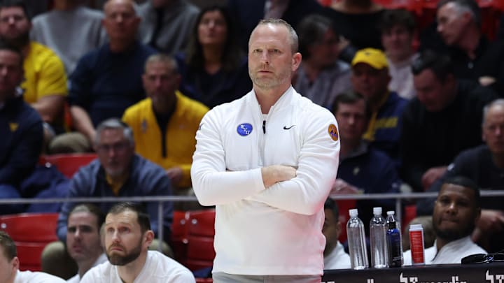 Mar 4, 2025; Salt Lake City, Utah, USA; West Virginia Mountaineers head coach Darian DeVries watches the play against the Utah Utes during the first half at Jon M. Huntsman Center. Mandatory Credit: Rob Gray-Imagn Images