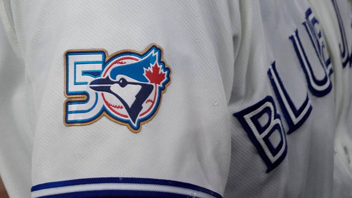 Mar 29, 2026; Toronto, Ontario, CAN; The Toronto Blue Jays 50th anniversary logo displayed on the jersey of third baseman Kazuma Okamoto (7) duringa game against the Athletics  at Rogers Centre. Mandatory Credit: John E. Sokolowski-Imagn Images