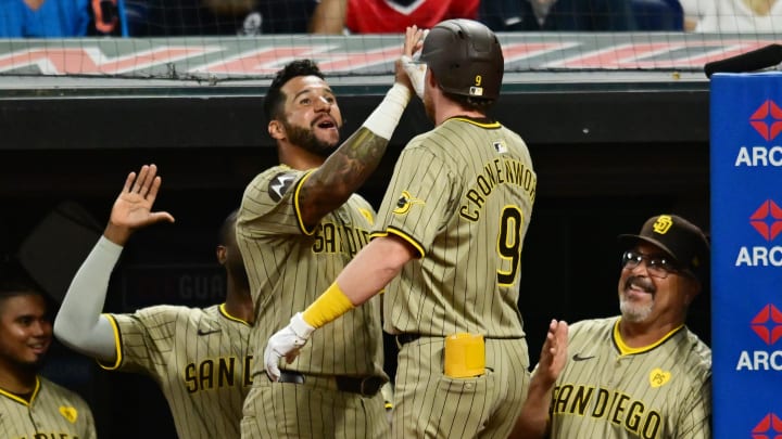 Jul 20, 2024; Cleveland, Ohio, USA; San Diego Padres designated hitter Jake Cronenworth (9) celebrates with right fielder David Peralta (24) after hitting a home run during the eighth inning against the Cleveland Guardians at Progressive Field. Mandatory Credit: Ken Blaze-USA TODAY Sports