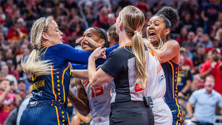 Jun 17, 2025; Indianapolis, Indiana, USA; Indiana Fever guard Sophie Cunningham (8) and Connecticut Sun guard Jacy Sheldon (4) get into a fight in the second half at Gainbridge Fieldhouse. Mandatory Credit: Trevor Ruszkowski-Imagn Images