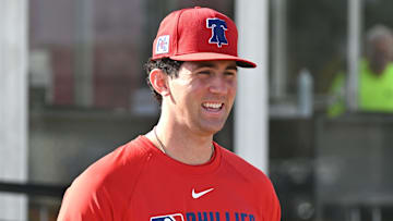 Feb 12, 2025; Clearwater, FL, USA; Philadelphia Phillies pitcher Andrew Painter (76) walks onto the field before the start of a spring training workout at Carpenter Complex