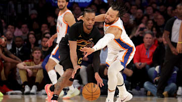 Apr 11, 2025; New York, New York, USA; Cleveland Cavaliers guard Darius Garland (10) and New York Knicks guard Jalen Brunson (11) fight for a loose ball during the fourth quarter at Madison Square Garden. Mandatory Credit: Brad Penner-Imagn Images