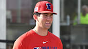 Feb 12, 2025; Clearwater, FL, USA; Philadelphia Phillies pitcher Andrew Painter (76) walks onto the field before the start of a spring training workout at Carpenter Complex