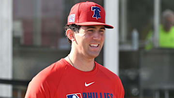 Feb 12, 2025; Clearwater, FL, USA; Philadelphia Phillies pitcher Andrew Painter (76) walks onto the field before the start of a spring training workout at Carpenter Complex