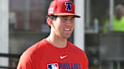 Philadelphia Phillies pitcher Andrew Painter walks onto the field before the start of a spring training workout at Carpenter Complex in Clearwater, Fla., on Feb. 12, 2025.