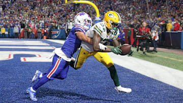 Packers receiver Romeo Doubs  catches a 19 yards touchdown pass as he beats the tight coverage by Bills safety Damar Hamlin.

Ag3i6467
