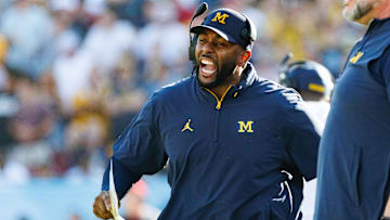 Dec 31, 2024; Tampa, FL, USA; Michigan Wolverines head coach Sherrone Moore screams from the sideline against the Alabama Crimson Tide during the second half at Raymond James Stadium. Mandatory Credit: Matt Pendleton-Imagn Images