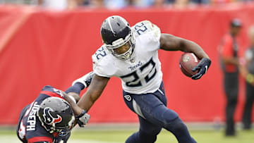 Tennessee Titans running back Derrick Henry gains yards push off Houston Texans cornerback Johnathan Joseph.