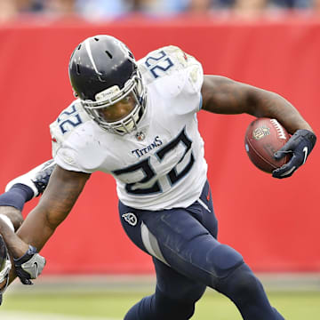 Tennessee Titans running back Derrick Henry gains yards push off Houston Texans cornerback Johnathan Joseph.
