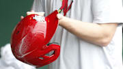 Jul 3, 2024; Pittsburgh, Pennsylvania, USA;  A St. Louis Cardinals equipment manager shines the batting helmets prior to a game against the Pittsburgh Pirates at PNC Park. Mandatory Credit: Charles LeClaire-Imagn Images
