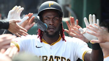 Jun 29, 2025; Pittsburgh, Pennsylvania, USA;  Pittsburgh Pirates center fielder Oneil Cruz (15) celebrates in the dugout after hitting his second home run of the game against the New York Mets during the seventh inning at PNC Park. Mandatory Credit: Charles LeClaire-Imagn Images