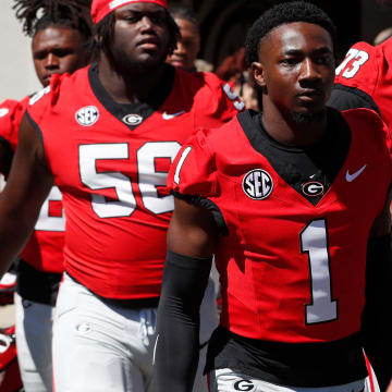 Georgia running back Trevor Etienne (1) arrives with the team before the start of the G-Day spring