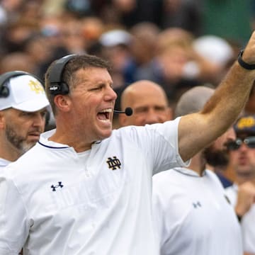 Sep 20, 2025; South Bend, Indiana, USA; Notre Dame Fighting Irish defensive coordinator Chris Ash shouts towards the field against the Purdue Boilermakers during the first half at Notre Dame Stadium. 
