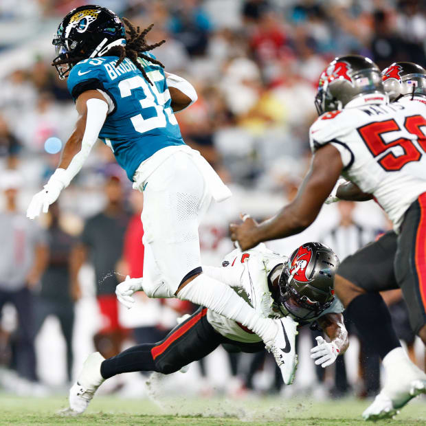 Jacksonville Jaguars running back Gary Brightwell (35)runs with the ball as Tampa Bay Buccaneers safety Marcus Banks (39).