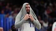 Nov 10, 2024; Denver, Colorado, USA; Dallas Mavericks guard Luka Doncic (77) awaits to come into second half against the Denver Nuggets at Ball Arena. Mandatory Credit: Ron Chenoy-Imagn Images