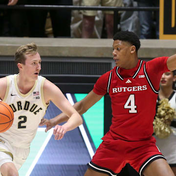 Purdue Boilermakers guard Fletcher Loyer (2) drives past Rutgers Scarlet Knights guard Ace Bailey (4) Tuesday, March 4, 2025, during the NCAA men’s basketball game at Mackey Arena in West Lafayette, Ind.