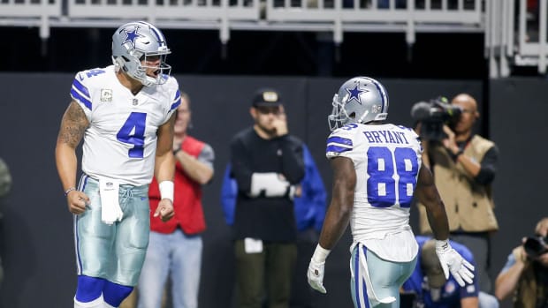 Dallas Cowboys quarterback Dak Prescott (4) celebrates a touchdown with wide receiver Dez Bryant (88) against the Atlanta Fal