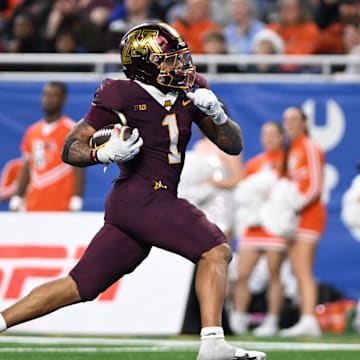 Dec 26, 2023; Detroit, MI, USA;  Minnesota Golden Gophers running back Darius Taylor (1) runs for a touchdown against the Bowling Green Falcons in the fourth quarter at Ford Field. Mandatory Credit: Lon Horwedel-Imagn Images