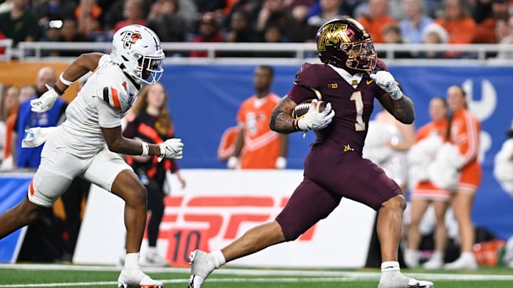 Dec 26, 2023; Detroit, MI, USA;  Minnesota Golden Gophers running back Darius Taylor (1) runs for a touchdown against the Bowling Green Falcons in the fourth quarter at Ford Field. Mandatory Credit: Lon Horwedel-Imagn Images