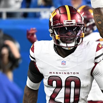 Jan 18, 2025; Detroit, Michigan, USA; Washington Commanders defensive back Quan Martin (20) celebrates a touchdown after an interception during the second quarter against Detroit Lions in a 2025 NFC divisional round game at Ford Field. Mandatory Credit: Lon Horwedel-Imagn Images