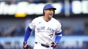 Jun 27, 2024; Toronto, Ontario, CAN; Toronto Blue Jays right fielder George Springer (4) reacts as he runs to third base on his second three-run home run of the game against the New York Yankees during the second inning at Rogers Centre.