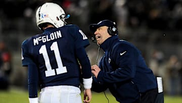 Penn State Nittany Lions head coach Bill O'Brien (right) talks to quarterback Matt McGloin (11)