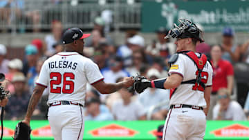 Jun 29, 2025; Cumberland, Georgia, Atlanta Braves relief pitcher Raisel Iglesias (26) and Atlanta Braves catcher Sean Murphy (12) fist bump during a game against the Philadelphia Phillies during the ninth inning at Truist Park. Mandatory Credit: Mady Mertens-Imagn Images