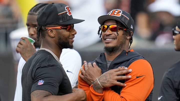 Cincinnati Bengals running back Joe Mixon (28) and wide receiver Ja'Marr Chase (1) laugh during warmups before the first quarter of the NFL Preseason Week 1 game between the Cincinnati Bengals and the Green Bay Packers at Paycor Stadium in downtown Cincinnati on Friday, Aug. 11, 2023. The Packers led 21-16 at halftime.