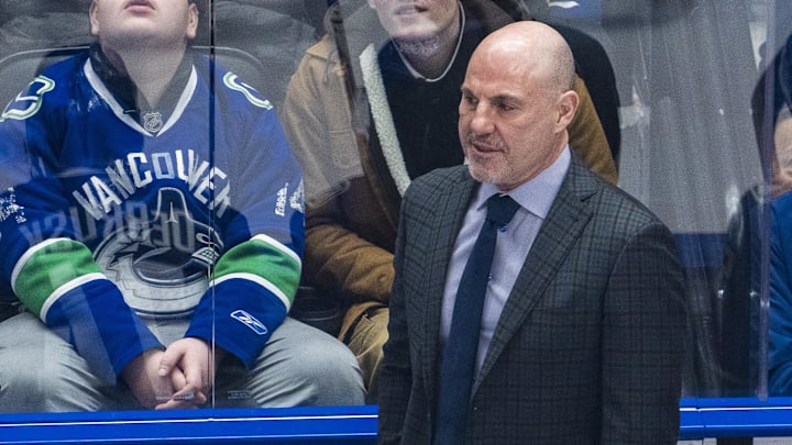 Rick Tocchet coaches the Canucks against the Avalanche.