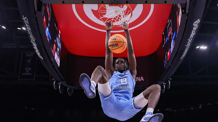 Dec 20, 2025; Atlanta, Georgia, USA; North Carolina Tar Heels forward Caleb Wilson (8) dunks against the Ohio State Buckeyes in the second half at State Farm Arena. Mandatory Credit: Brett Davis-Imagn Images
