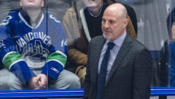 Feb 4, 2025; Vancouver, British Columbia, CAN;  Vancouver Canucks head coach Rick Tocchet on the bench against the Colorado Avalanche in the first period at Rogers Arena. Mandatory Credit: Bob Frid-Imagn Images