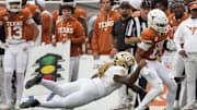 Nov 1, 2025; Austin, Texas, USA; Vanderbilt Commodores defensive back CJ Heard (8) tackles Texas Longhorns wide receiver Daylan McCutcheon (17) during the second half at Darrell K Royal-Texas Memorial Stadium. Mandatory Credit: Scott Wachter-Imagn Images