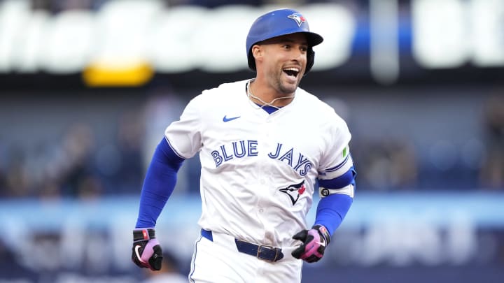 Jun 27, 2024; Toronto, Ontario, CAN; Toronto Blue Jays right fielder George Springer (4) reacts as he runs to third base on his second three-run home run of the game against the New York Yankees during the second inning at Rogers Centre. Mandatory Credit: John E. Sokolowski-USA TODAY Sports