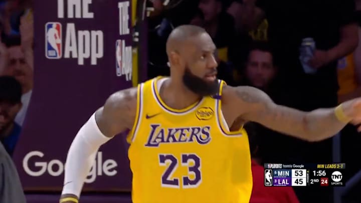 LeBron James points to Kyrie Irving after a dunk LeBron James points to Kyrie Irving after a dunk