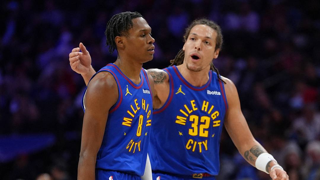 Jan 31, 2025; Philadelphia, Pennsylvania, USA; Denver Nuggets guard Peyton Watson (8) reacts with forward Aaron Gordon (32) against the Philadelphia 76ers in the second quarter at Wells Fargo Center.