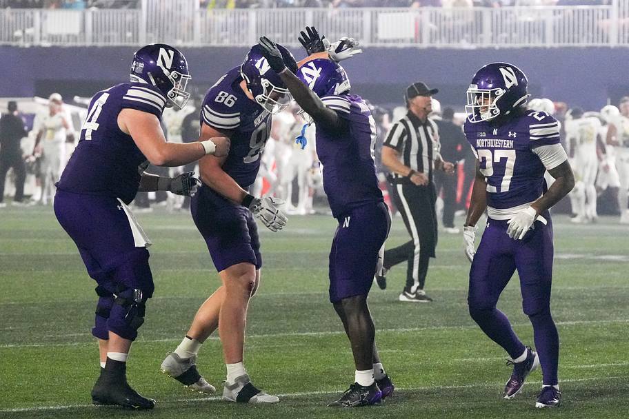 Wildcats running back Joseph Himon II celebrates his touchdown with tight end Alex Honig (86) against Colorado.