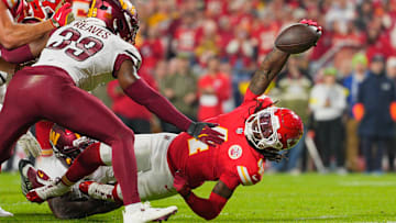 Oct 27, 2025; Kansas City, Missouri, USA; Kansas City Chiefs wide receiver Rashee Rice (4) carries the ball against the Washington Commanders during the second quarter of the game at GEHA Field at Arrowhead Stadium. Mandatory Credit: Jay Biggerstaff-Imagn Images