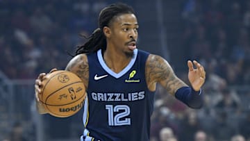 Nov 15, 2025; Cleveland, Ohio, USA; Memphis Grizzlies guard Ja Morant (12) dribbles the ball in the first quarter against the Cleveland Cavaliers at Rocket Arena. Mandatory Credit: David Richard-Imagn Images