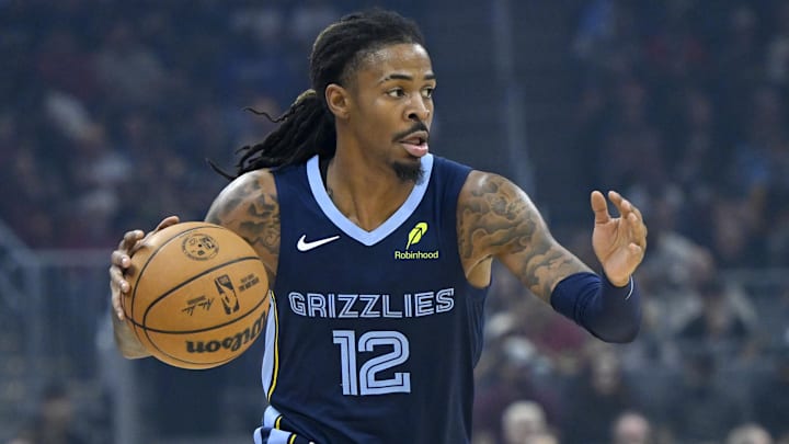 Nov 15, 2025; Cleveland, Ohio, USA; Memphis Grizzlies guard Ja Morant (12) dribbles the ball in the first quarter against the Cleveland Cavaliers at Rocket Arena. Mandatory Credit: David Richard-Imagn Images