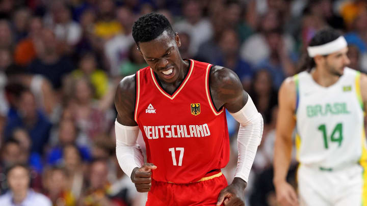 Jul 30, 2024; Villeneuve-d'Ascq, France; Germany point guard Dennis Schroder (17) reacts after making a three pointer against Brazil in men’s basketball group B play during the Paris 2024 Olympic Summer Games at Stade Pierre-Mauroy. Mandatory Credit: John David Mercer-USA TODAY Sports