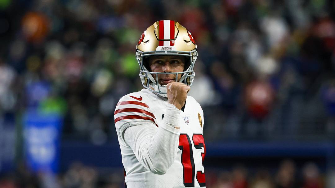 Nov 23, 2023; Seattle, Washington, USA; San Francisco 49ers quarterback Brock Purdy (13) reacts following a rushing touchdown by wide receiver Deebo Samuel (19, not pictured) against the Seattle Seahawks during the first quarter at Lumen Field. Mandatory Credit: Joe Nicholson-Imagn Images