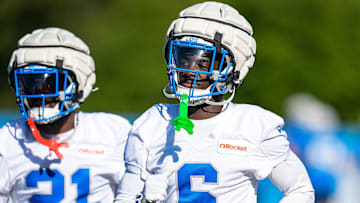 Detroit Lions cornerback Terrion Arnold (6), center, and cornerback Amik Robertson (21) practice during training camp at Meijer Performance Center in Allen Park on Tuesday, July 22, 2025.