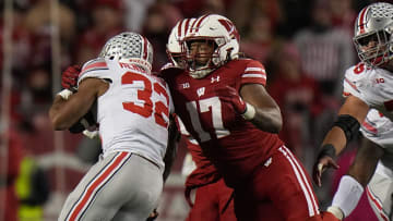 Wisconsin linebacker Darryl Peterson (17) tackles Ohio State running back TreVeyon Henderson (32) during the third quarter of their game Saturday, October 28, 2023 at Camp Randall Stadium in Madison, Wisconsin. Ohio State beat Wisconsin 24-10.