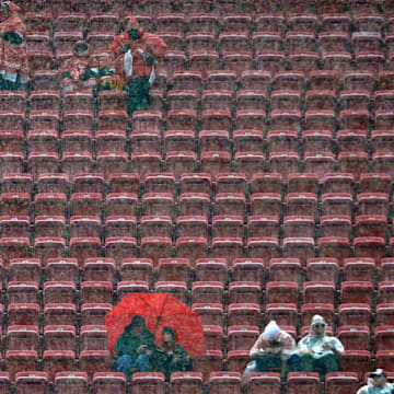 Dec 13, 2015; Kansas City, MO, USA; Fans watch team warmups in the rain before the game between the Kansas City Chiefs and San Diego Chargers at Arrowhead Stadium. Mandatory Credit: Denny Medley-Imagn Images