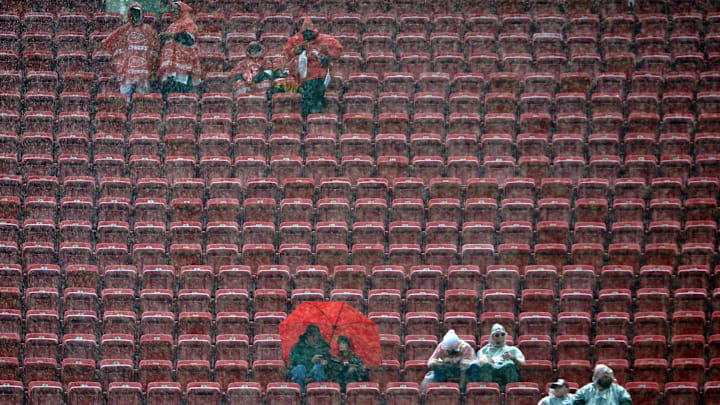 Dec 13, 2015; Kansas City, MO, USA; Fans watch team warmups in the rain before the game between the Kansas City Chiefs and San Diego Chargers at Arrowhead Stadium. Mandatory Credit: Denny Medley-Imagn Images