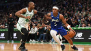 Orlando Magic forward Paolo Banchero (5) dribbles the ball while Boston Celtics center Al Horford (42) defends during the first half at TD Garden.