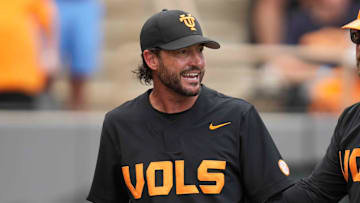 Tennessee assistant coach Ross Kivett leads Tennessee baseball head coach Tony Vitello back to the dugout after speaking with the umpire during a NCAA baseball game between the Tennessee Volunteers and Vanderbilt Commodores at Lindsey Nelson Stadium on May 11, 2025.