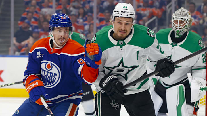 May 27, 2025; Edmonton, Alberta, CAN; Edmonton Oilers center Ryan Nugent-Hopkins (93) and Dallas Stars center Roope Hintz (24) chase the puck during the first period in game four of the Western Conference Final of the 2025 Stanley Cup Playoffs at Rogers Place. Mandatory Credit: Perry Nelson-Imagn Images