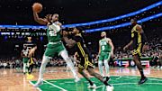 Mar 3, 2024; Boston, Massachusetts, USA: Boston Celtics center Al Horford (42) controls the ball while Golden State Warriors guard Gary Payton II (0) defends during the first half at TD Garden. Mandatory Credit: Bob DeChiara-Imagn Images